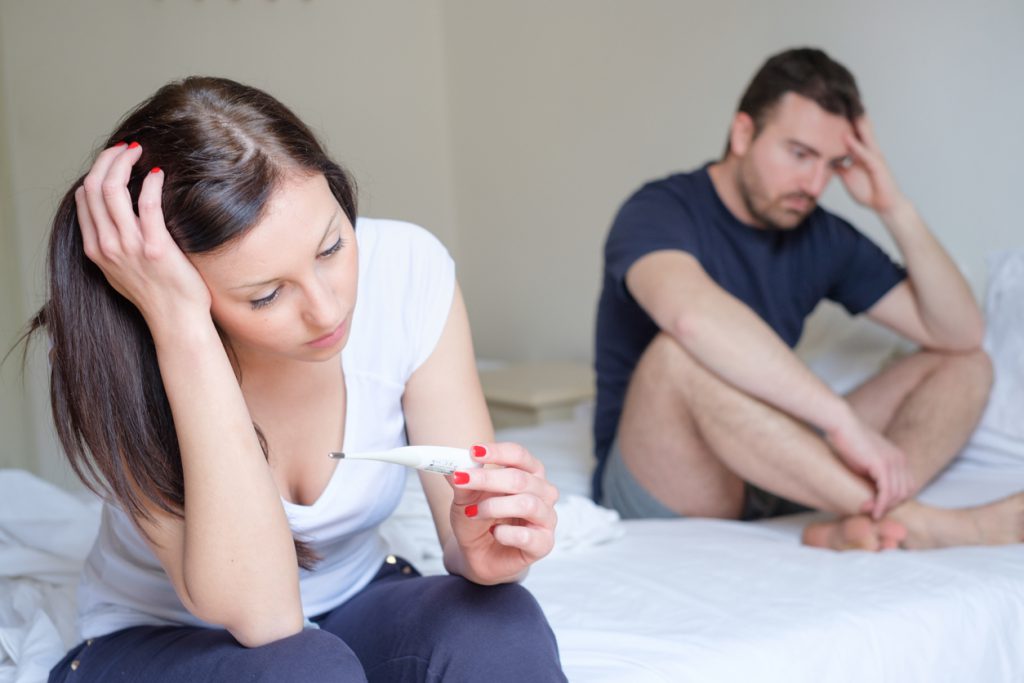 Couple Holding Negative Pregnancy Test